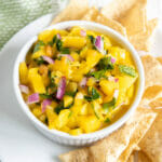 Mango Habanero Salsa on a plate with tortilla chips.