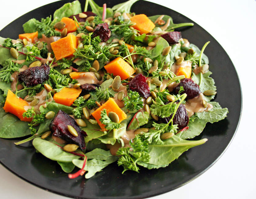 Roasted Beet and Butternut Squash Salad with Maple Tahini Dressing close up.