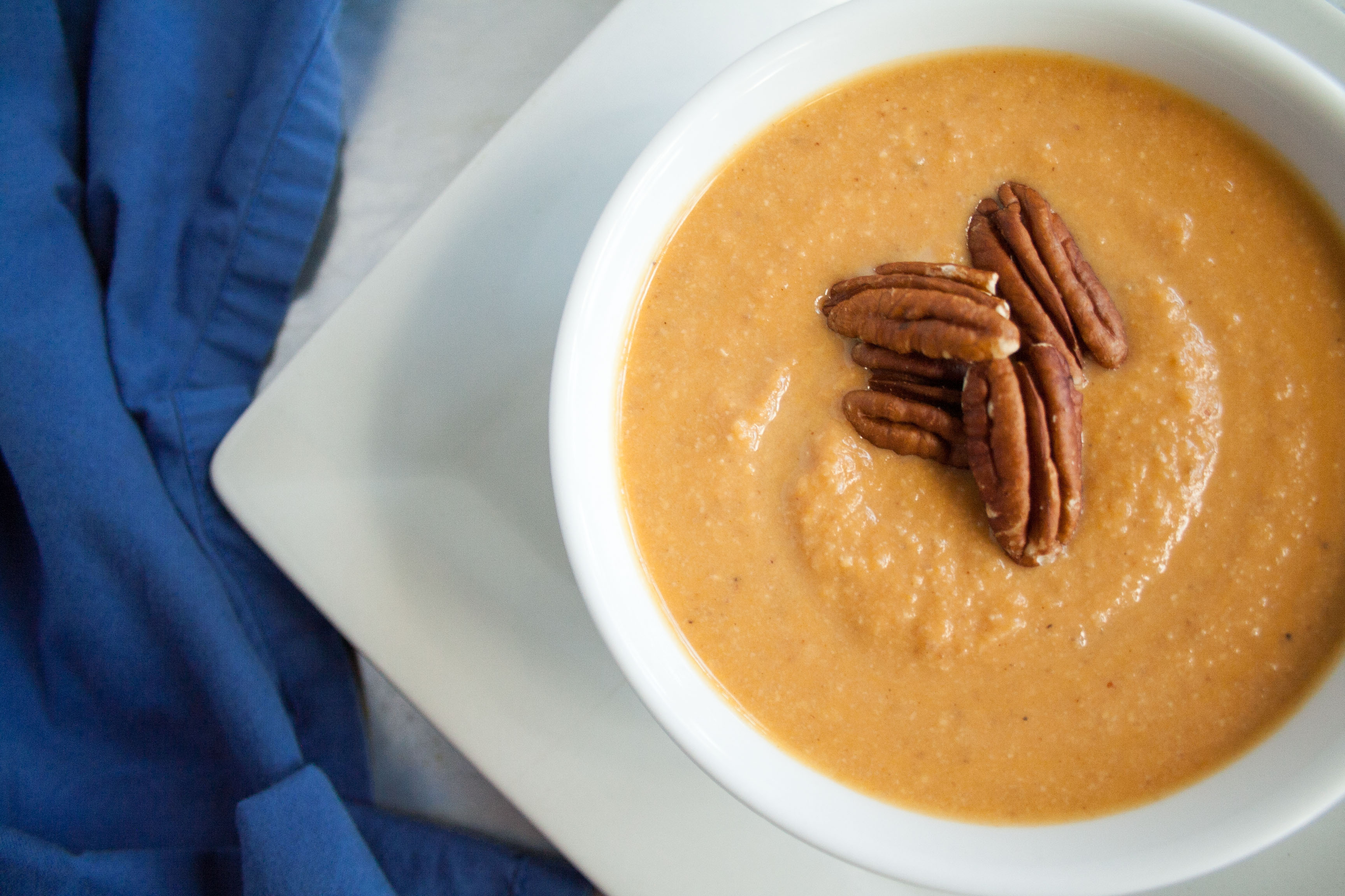 Sweet Potato Soup with Toasted Pecans close up.