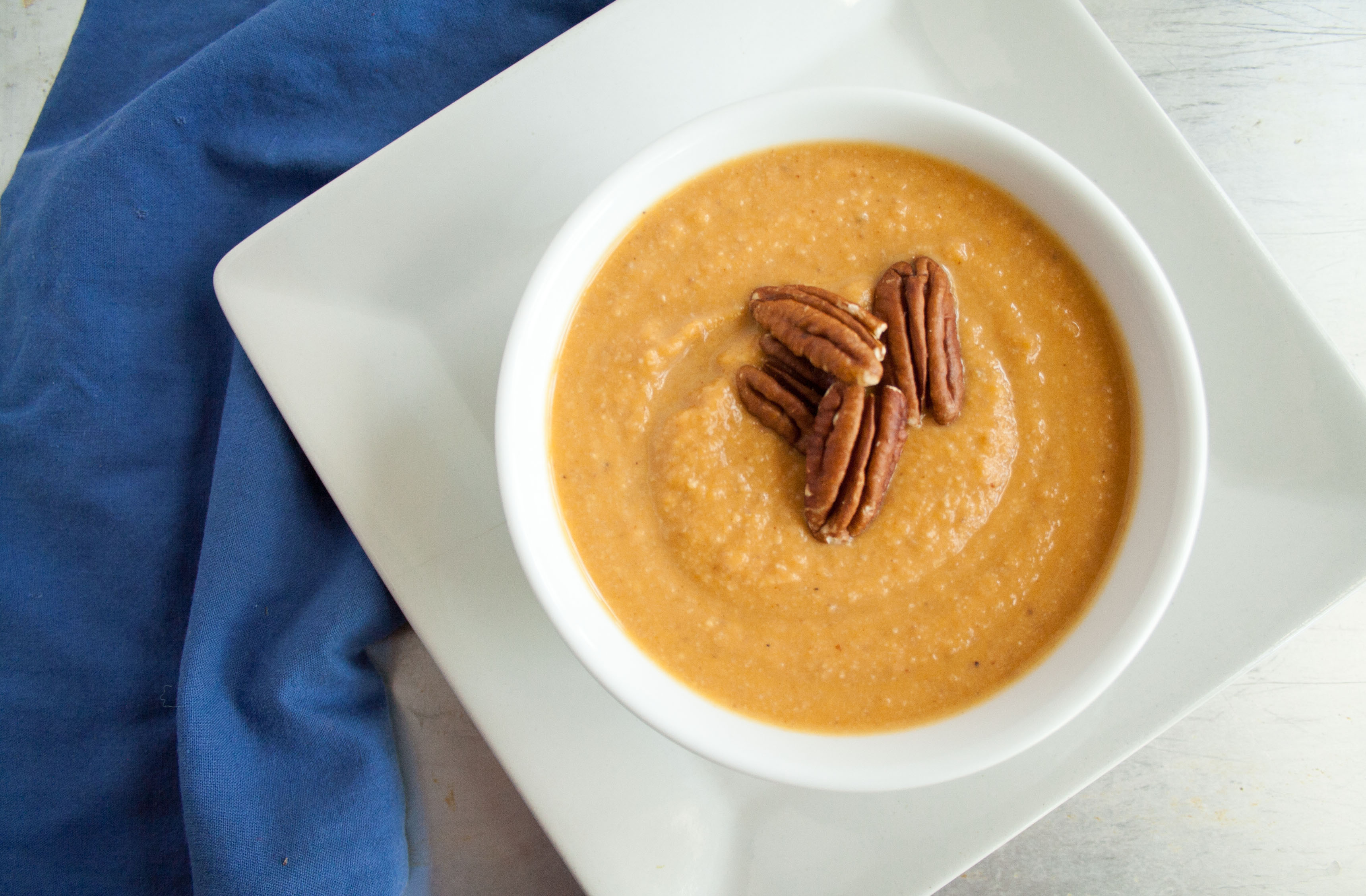 Sweet Potato Soup with Toasted Pecans in a bowl.