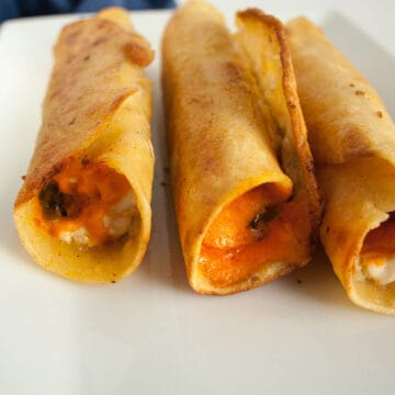 Vegan Taquitos with Green Chiles on a plate.