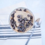 Vegan White Russian Ice Cream in glass dish with spoon.