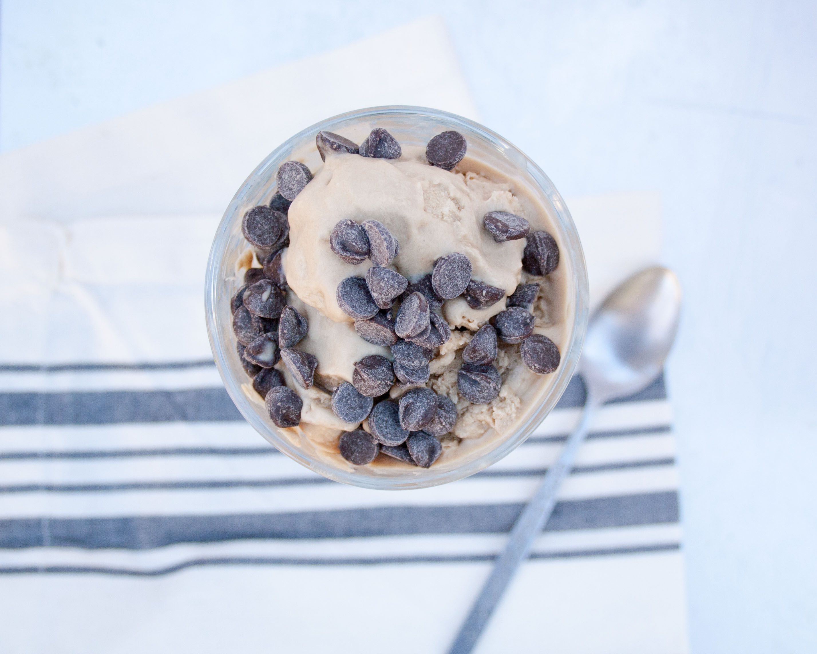 Vegan White Russian Ice Cream in glass dish with spoon.