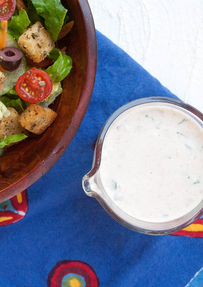 Vegan Ranch Dressing vertical view with salad.