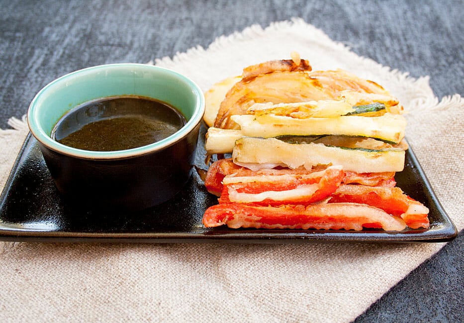Tempura Vegetables on a plate with dipping sauce.