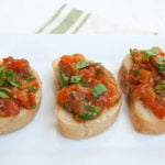 Roasted Tomato Bruschetta on a plate.