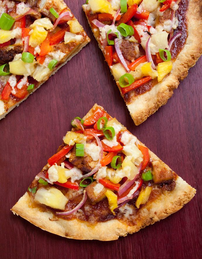 Vegan Hawaiian BBQ Pizza on a cutting board.