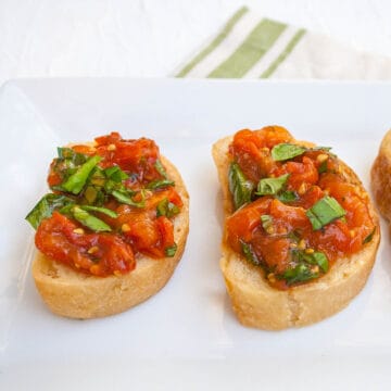 Roasted Tomato Bruschetta on a plate.