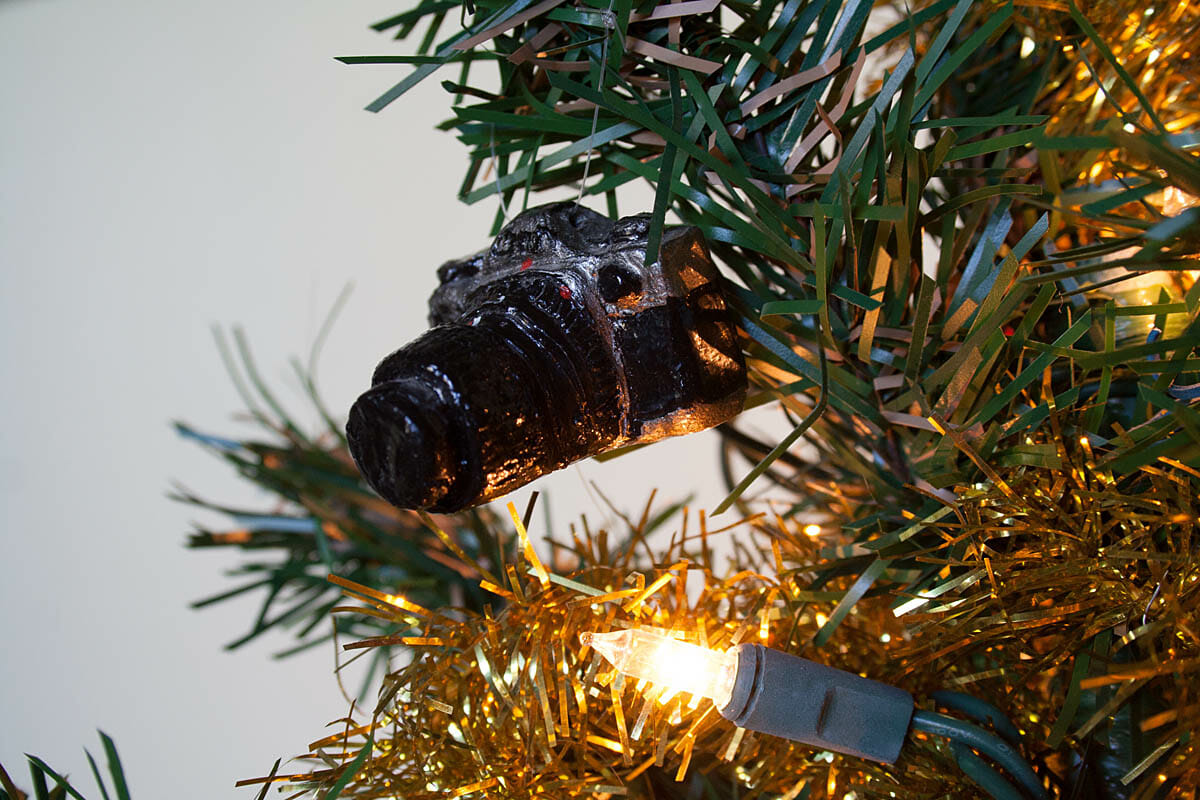 Camera ornament on Christmas tree.