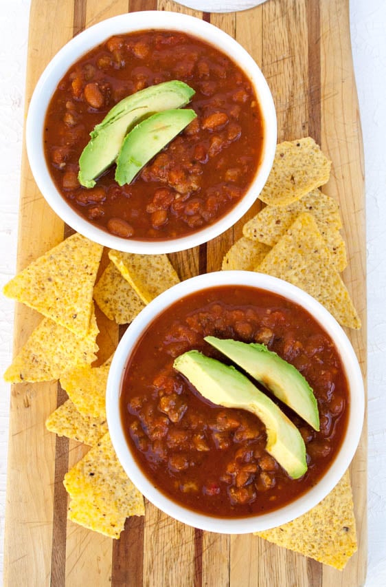  3 Ingredient Vegan Chili in two bowls with tortilla chips bird's eye view