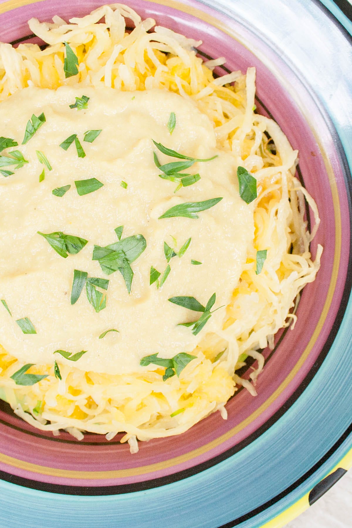 VeganCauliflower Alfredo Sauce on spaghetti squash.