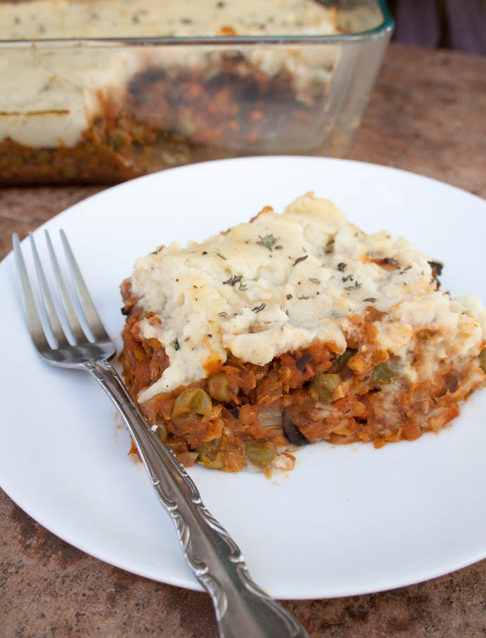 Lentil and Mushroom Shepherd's Pie on palate with a fork.