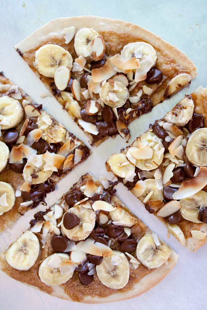 Banana, Chocolate and Peanut Butter Dessert Pizza on a sheet pan.