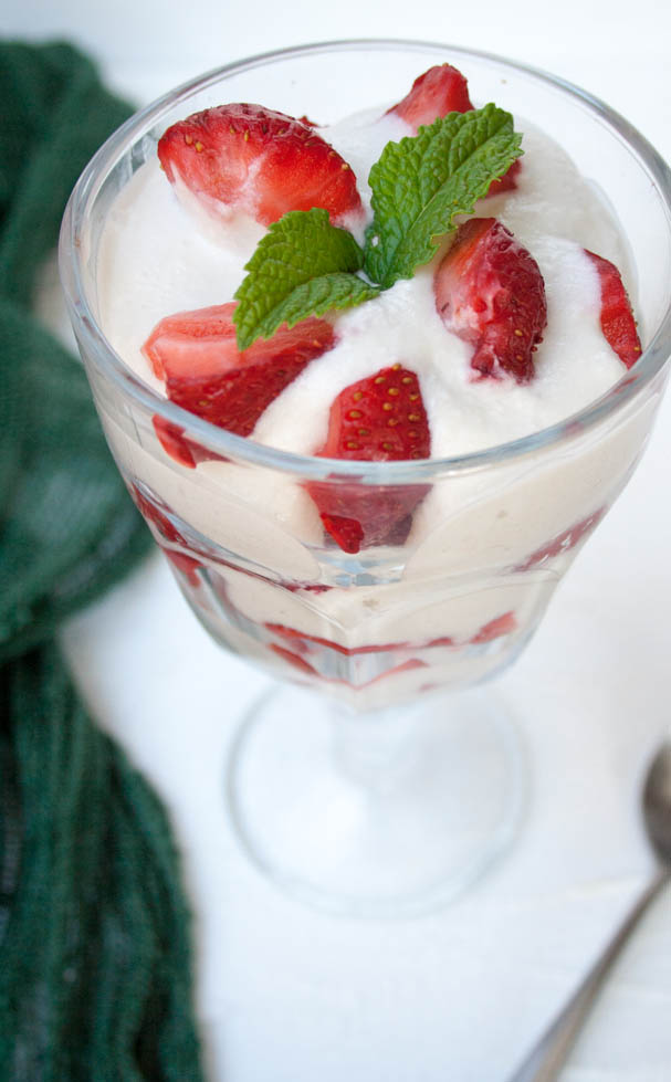 Strawberries and Coconut Cream in parfait glass.