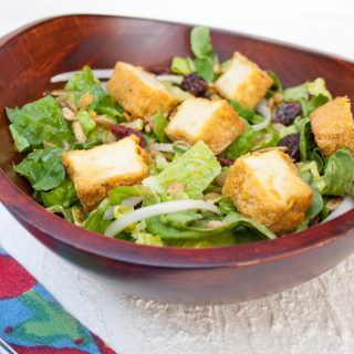 Crispy Tofu Salad with Sweet Mustard Dressing in a wood bowl.