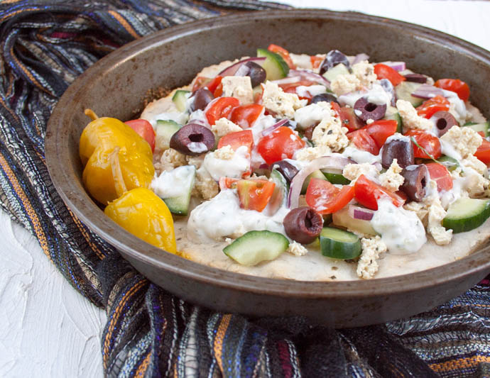 Greek Pizza with Tofu Feta close up.