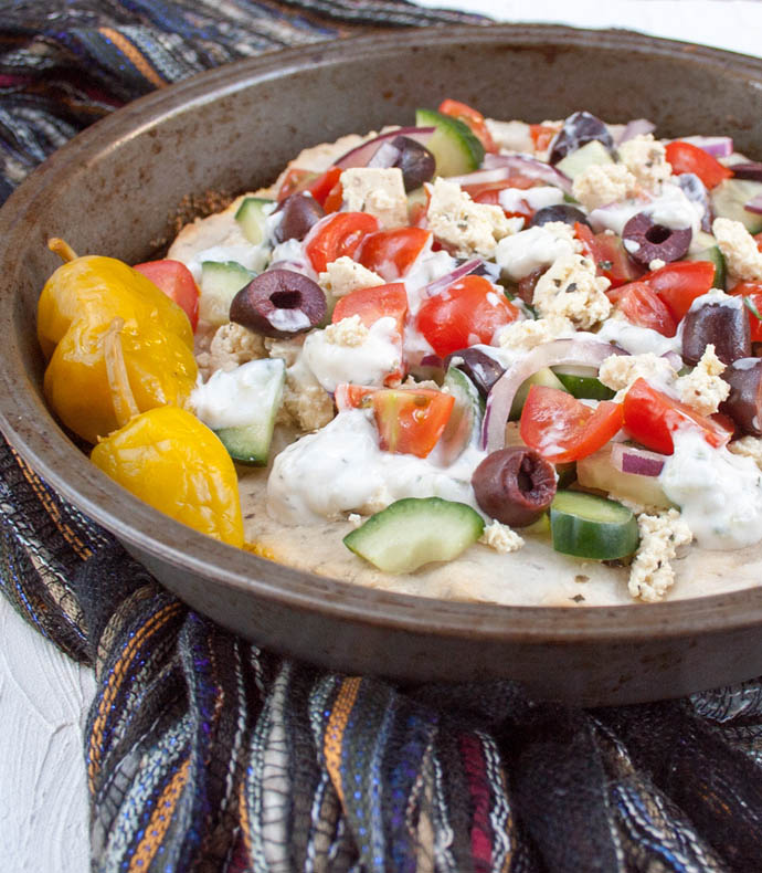 Greek Pizza with Tofu Feta close up.