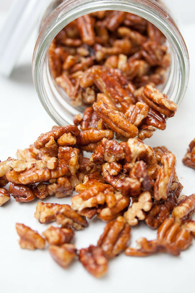 Candied Pumpkin Pie Spice Pecans spilling out of jar.