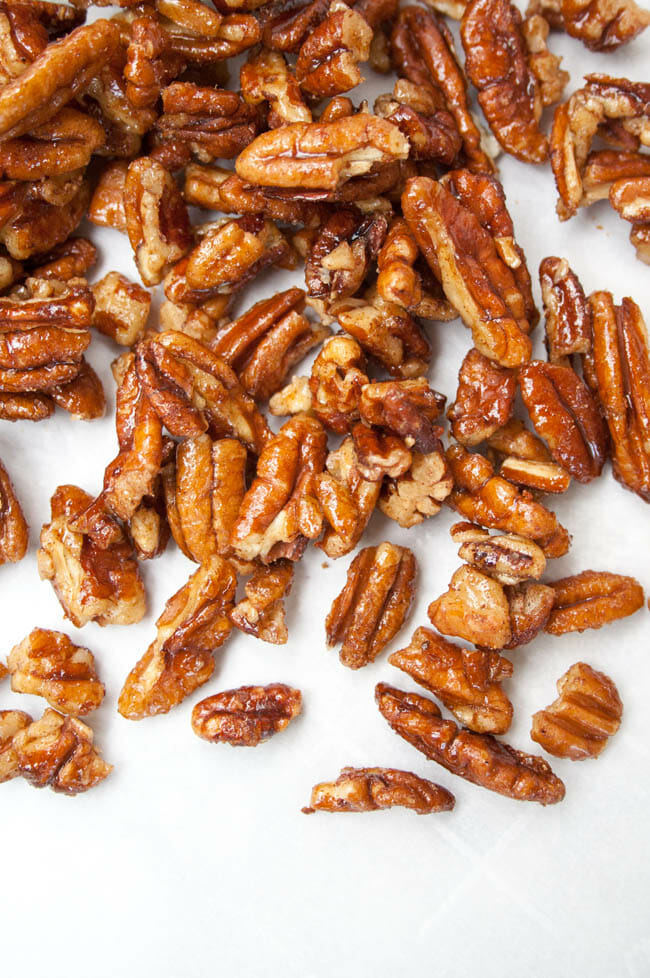 Candied Pumpkin Pie Spice Pecans on parchment paper.