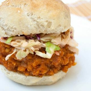 BBQ Lentil Sandwich with Sriracha Coleslaw on a plate.