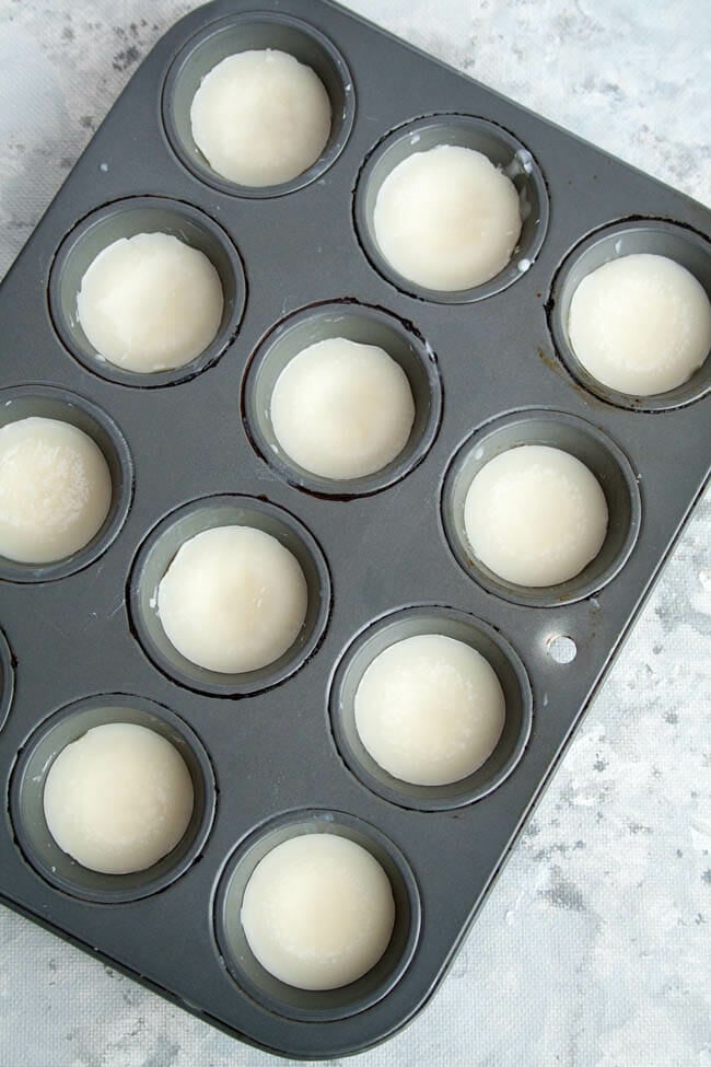 Peppermint Fat Bombs in a muffin pan before getting chocolate coating.