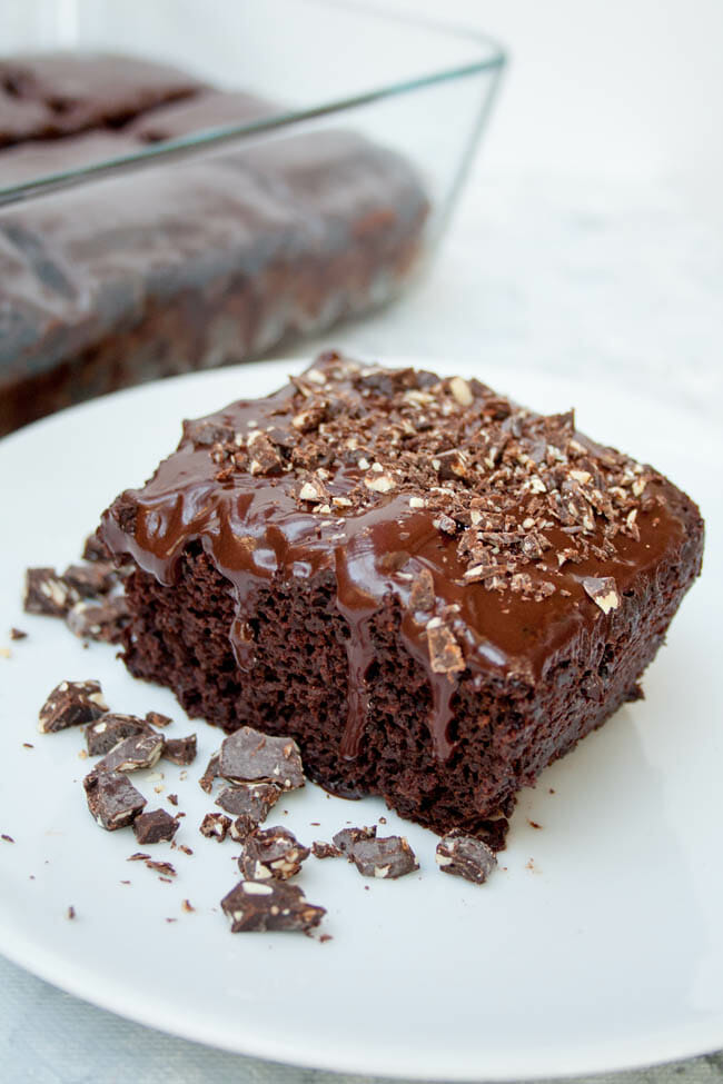 2 Ingredient Chocolate Cake on a plate and cake in baking dish in background.