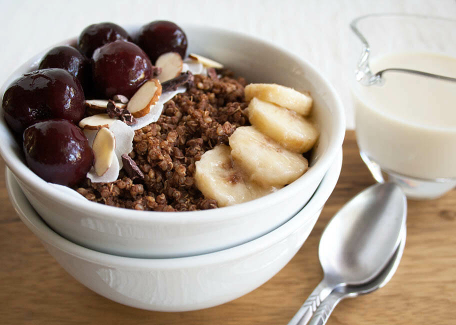 Chocolate Quinoa Breakfast Bowl in a bowl stacked on top of another bowl.