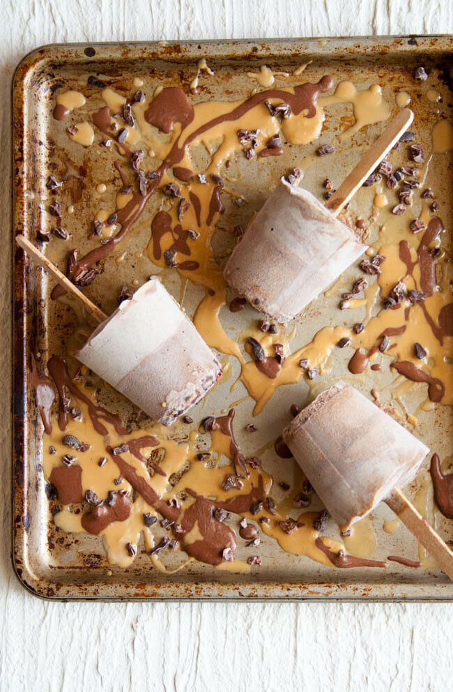 Chocolate Peanut Butter Chia Pudding Popsicles on sheet pan.