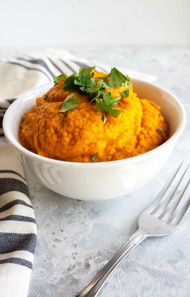 Chipotle Mashed Sweet Potatoes in a bowl with fork.