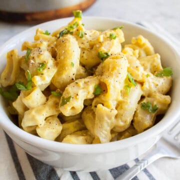 Tofu Mac and Cheese with fork and pan in background.