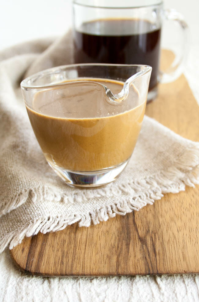 Gingerbread Coffee Creamer with coffee in background.