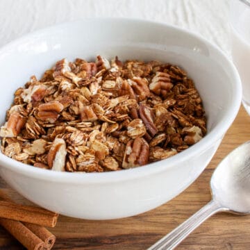 Gingerbread Granola in a bowl with spoon.