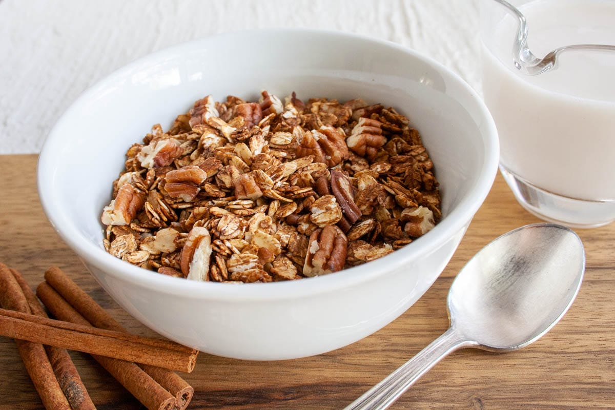 Gingerbread Granola in a bowl with spoon.