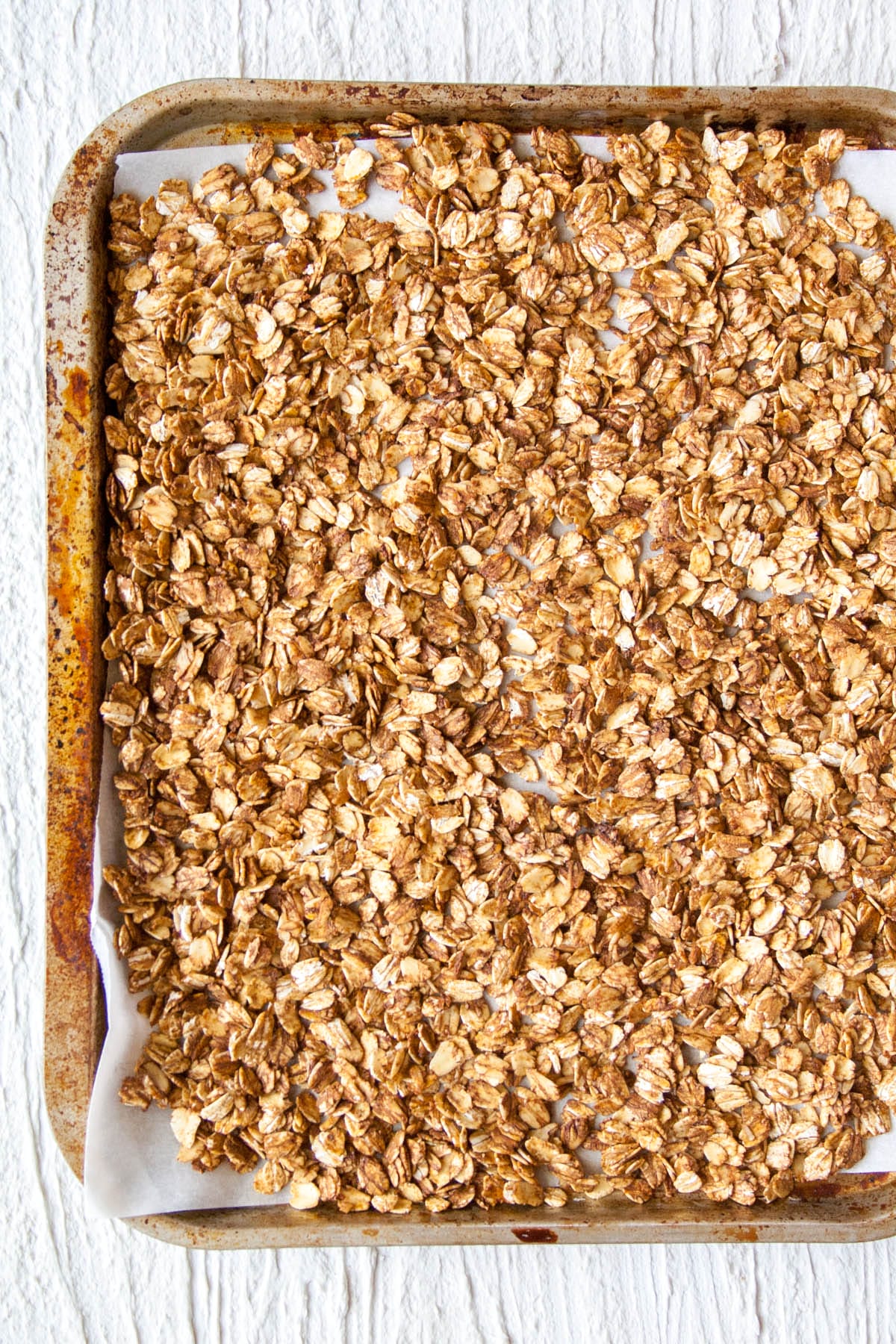 Baked Gingerbread Granola on a sheet pan.