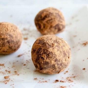 Mexican Chocolate Truffles on a plate close up.
