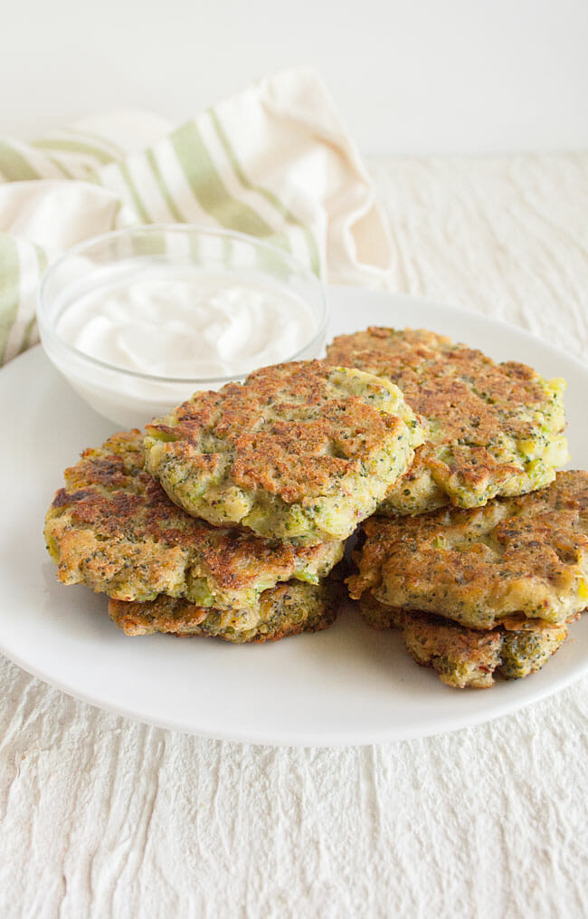 Broccoli Fritters on a plate with dipping sauce.