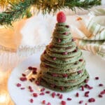 Christmas Tree Pancakes on a plate with goji berries.