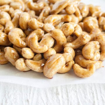 Candied Cashews on parchment paper.