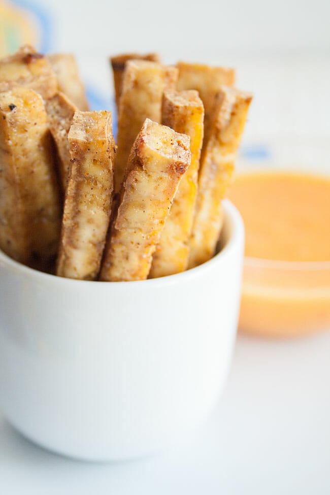 Sriracha Baked Tofu Fries in a cup close up.