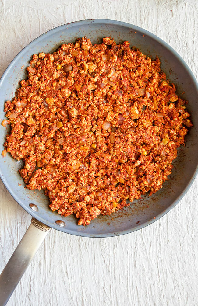 Spicy crumbled tofu taco meat in a pan birds eye view.