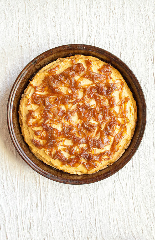 Caramelized Onions Quiche in pan.