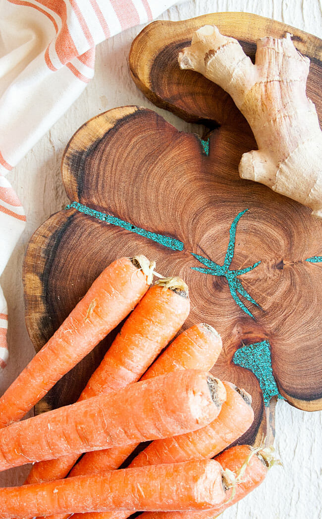 Carrots and ginger on cutting board.