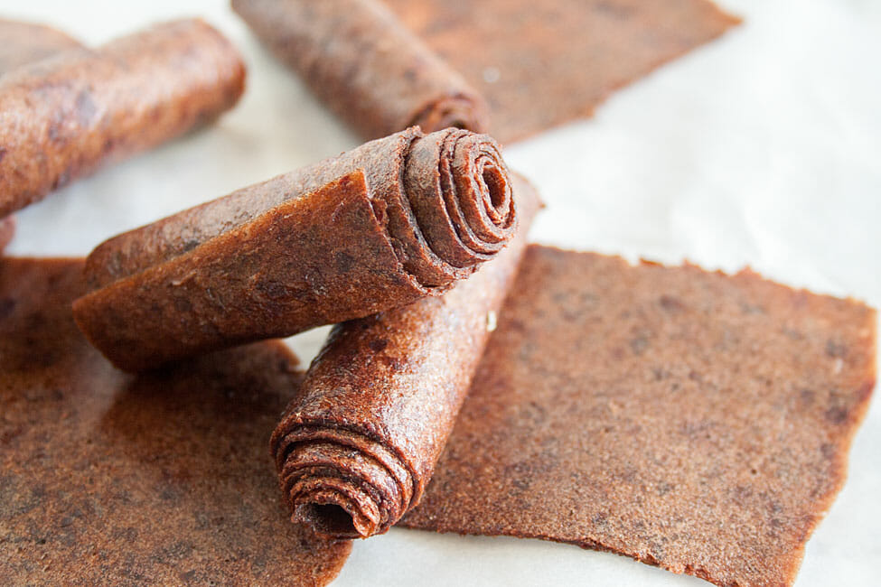 Cherry Banana Fruit Roll-Ups on parchment paper.