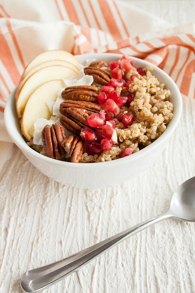 Spiced Quinoa Breakfast Bowl in bowl with spoon.