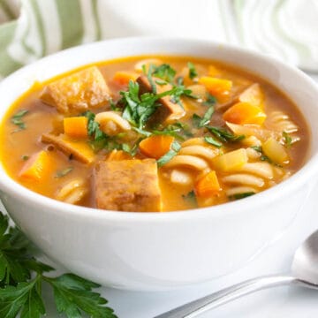 Tofu Noodle Soup in a bowl with spoon.