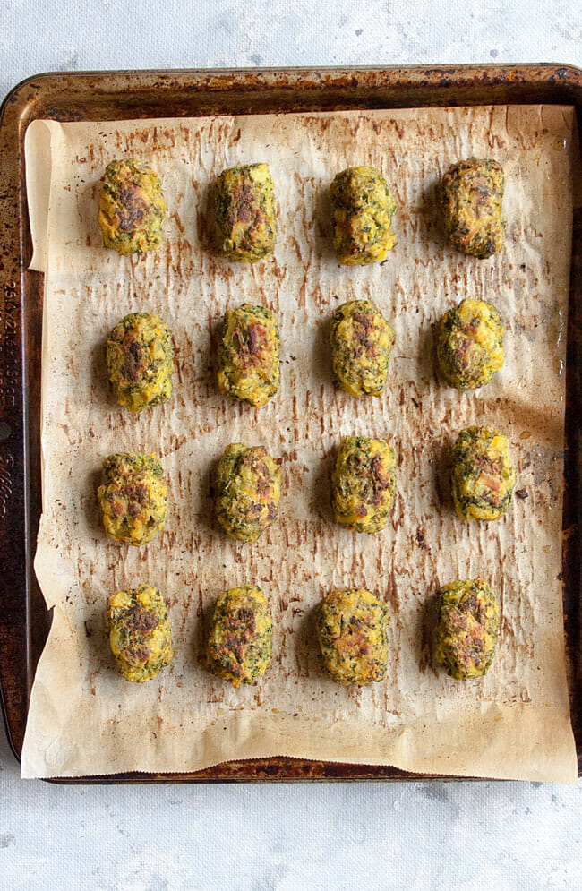 Broccoli Tots on a sheet pan after being baked bird's eye view.