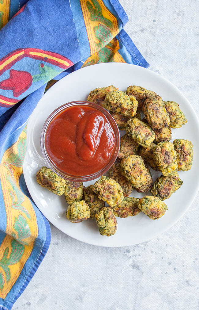 Broccoli Tots on a plate with ketchup bird's eye view.