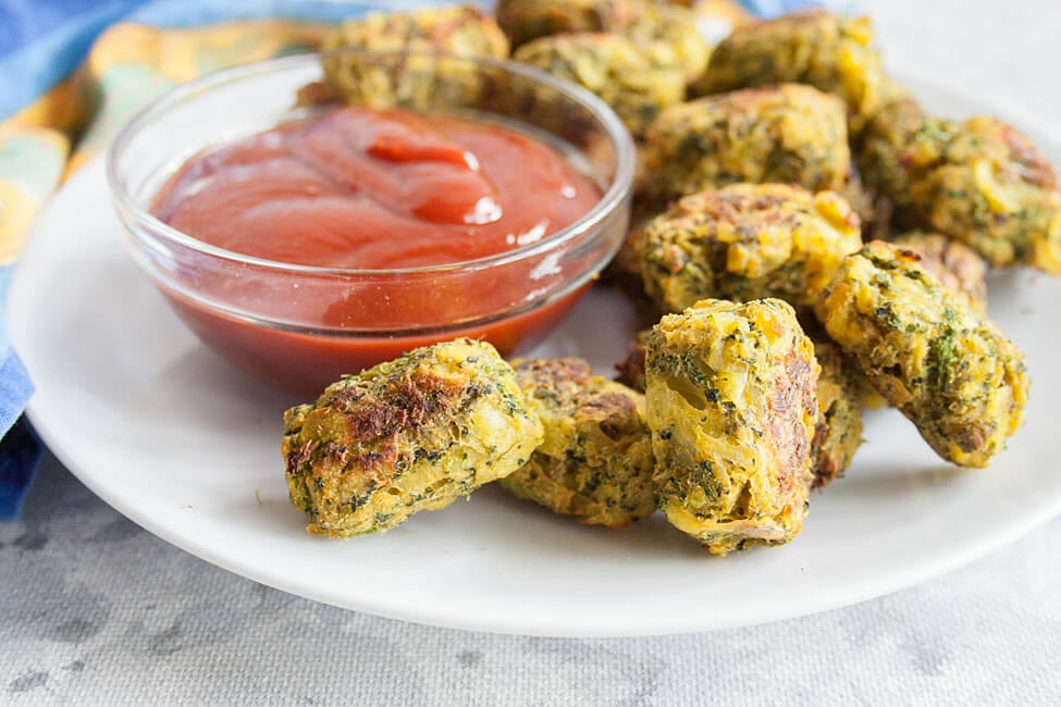 Broccoli Tots on plate with ketchup.