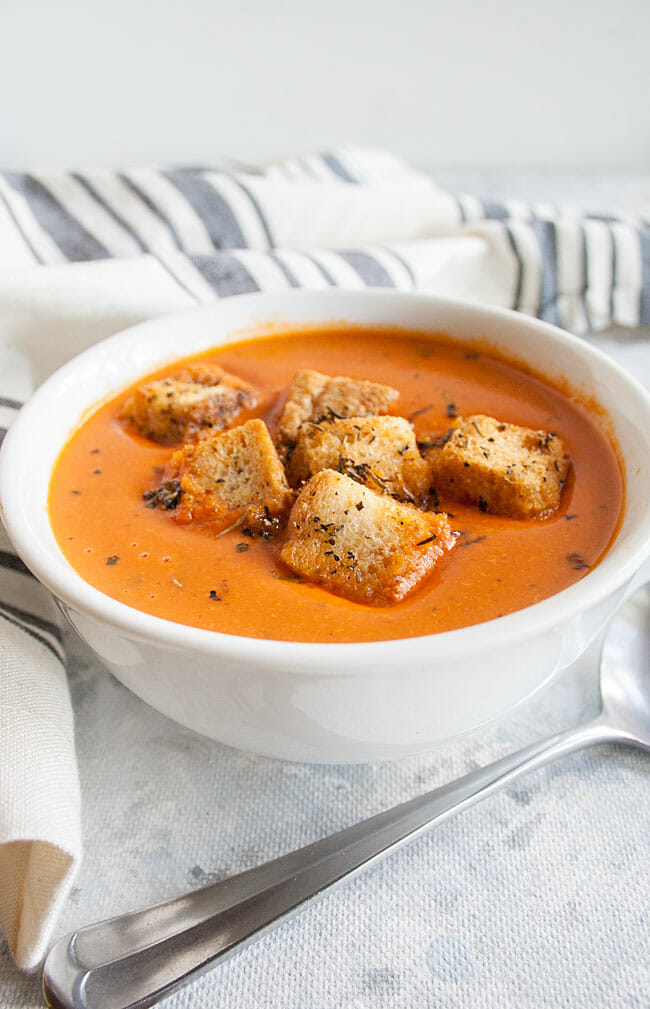 Easy Tomato Soup with homemade croutons on top.