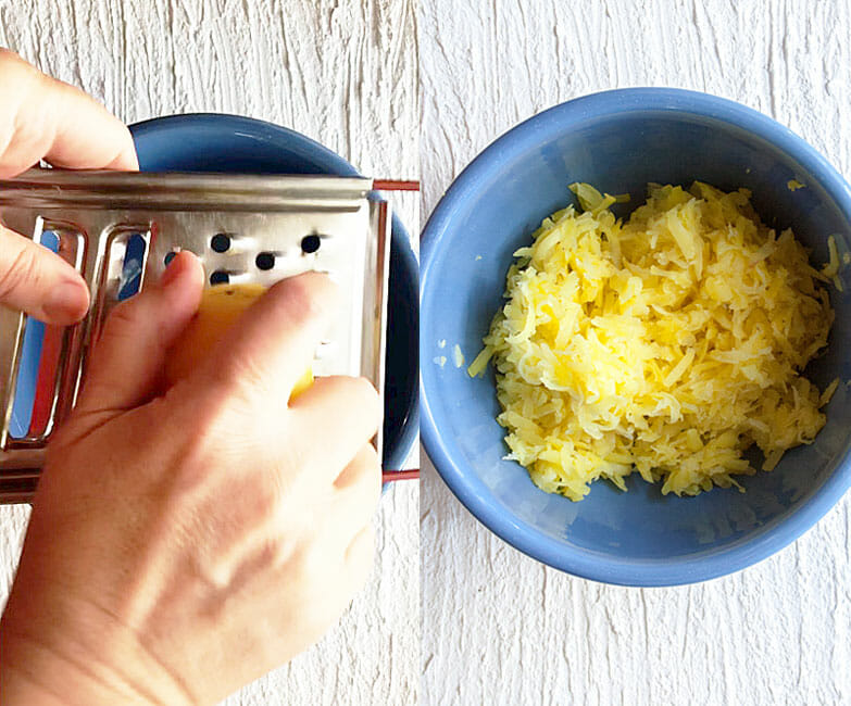 Potatoes being grated in bowl. 